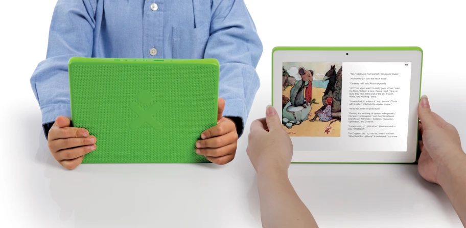 two hands holding an open green and black tablet