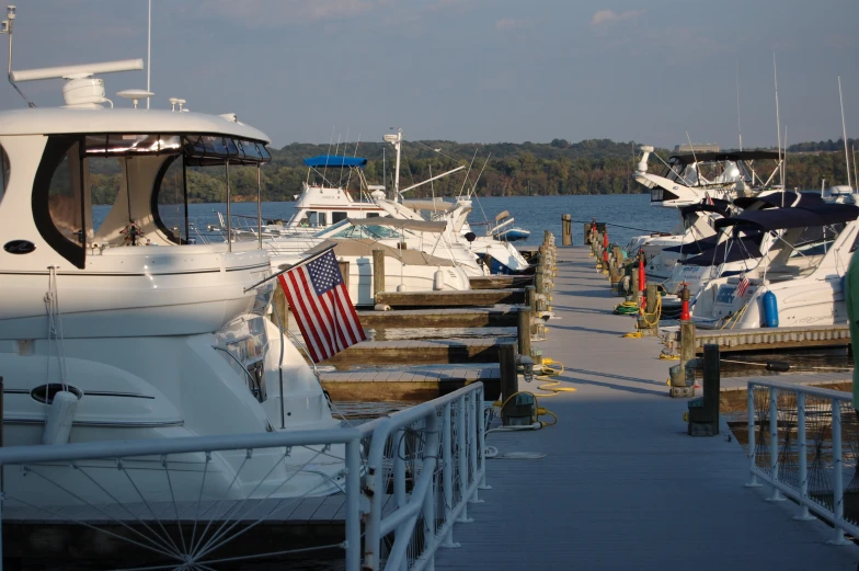 a few boats in the harbor with one docked