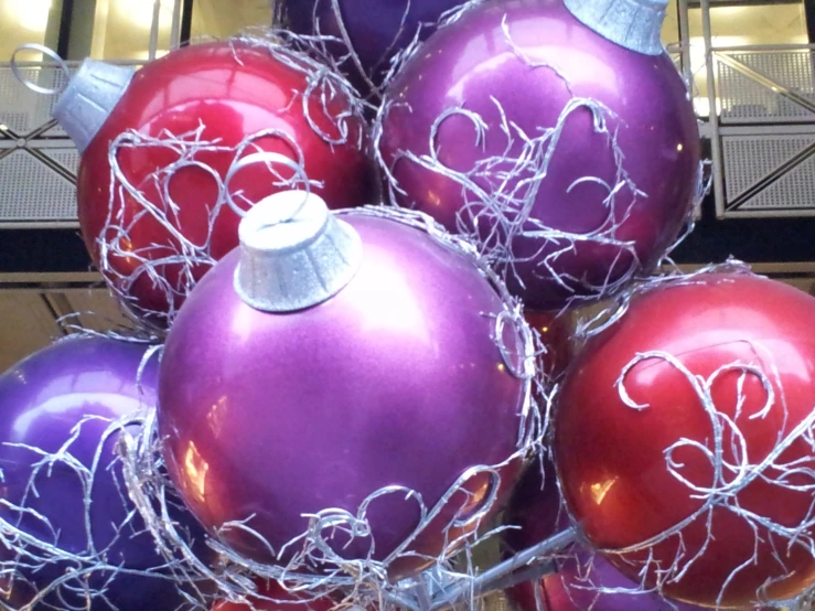 red and purple ornaments in a glass vase