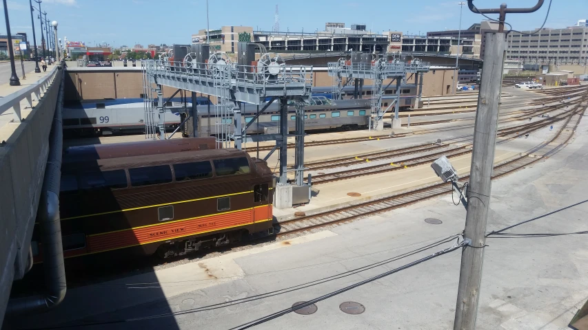 a train sits on a track with a building in the distance