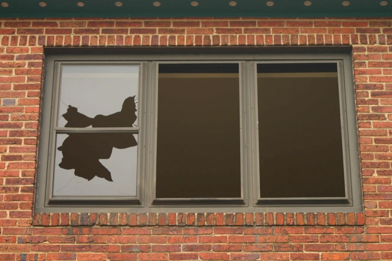 a reflection in the window of an old building