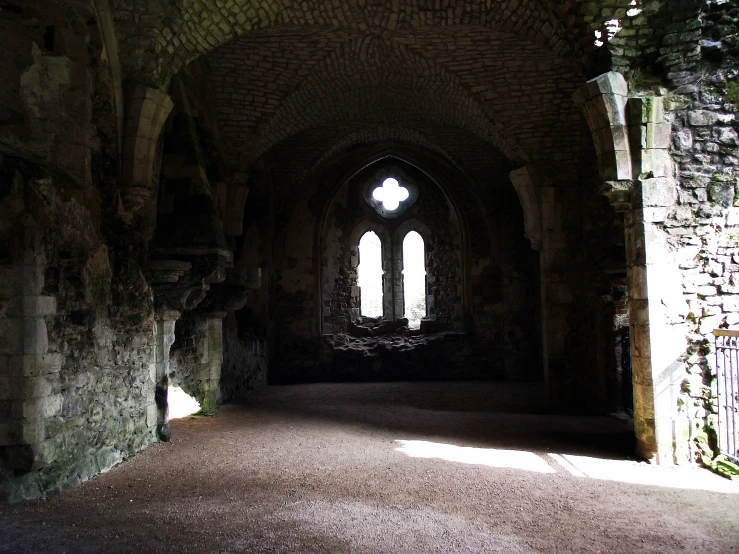 inside an old church with stained glass windows