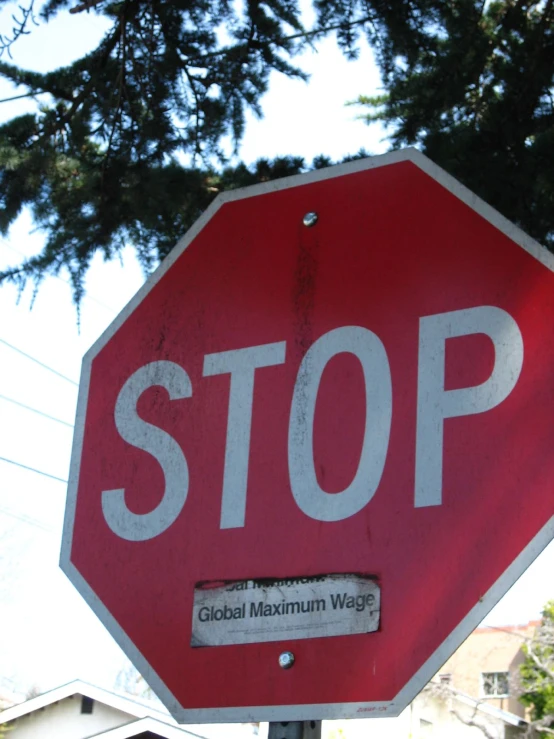 a red stop sign that reads global maximum wage