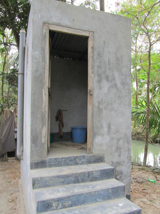 a small room that is made of cement and is outside