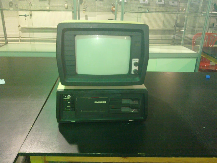 an old television with a small monitor on the side