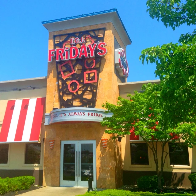 the front of a building with a store sign