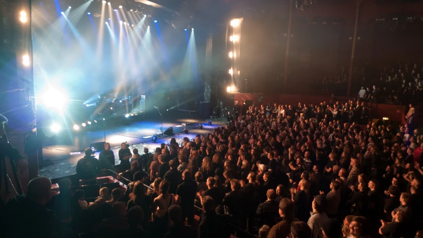 this is an image of a crowd watching someone on stage