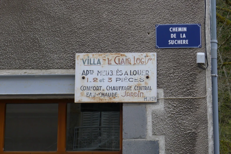 a sign outside of a building with foreign signs