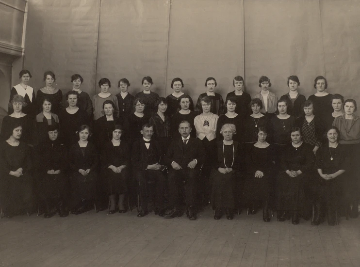 black and white po of a group of people in suits