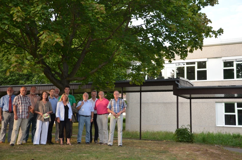 several people stand in front of a building