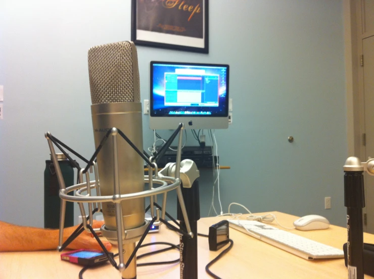 a recording microphone is in front of a monitor