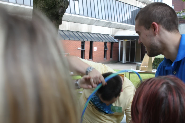 a man is checking out his hair for it to be dyed