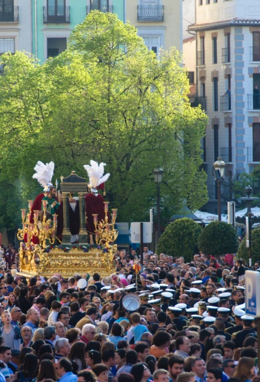 an overhead s of a large crowd with a large float in the middle