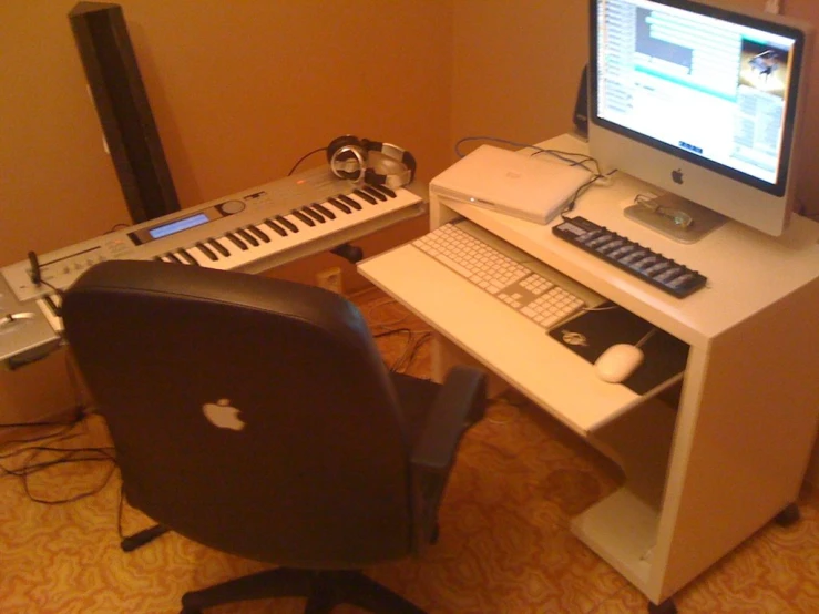 a desktop computer on a desk with two keyboards