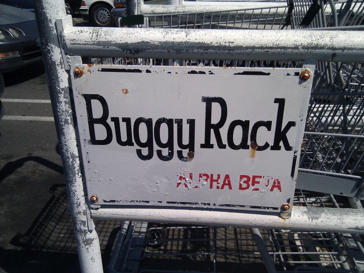 a buuy rock sign posted on the outside of a shopping cart
