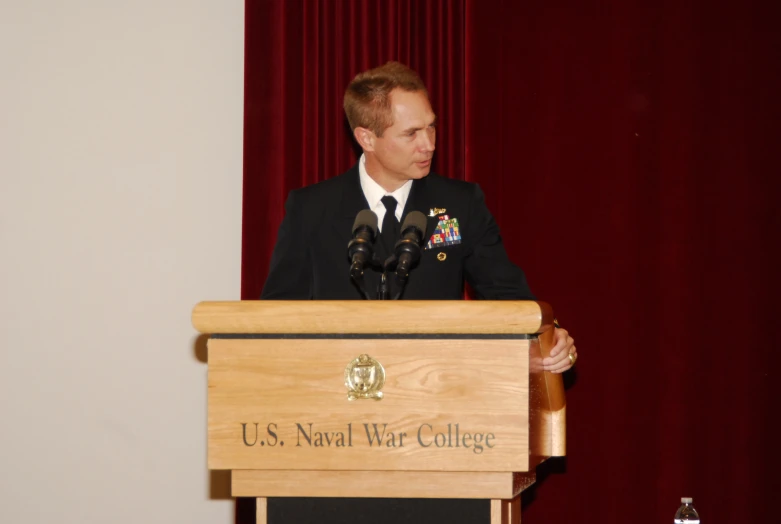 a man giving a speech on the front row