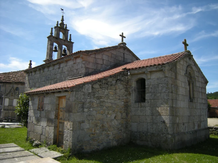 an old church with a cross on it