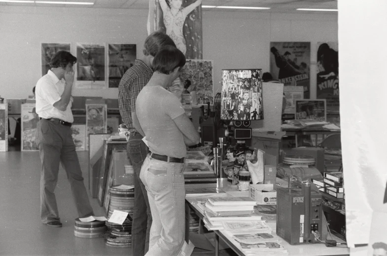 black and white pograph of a man shopping in a store