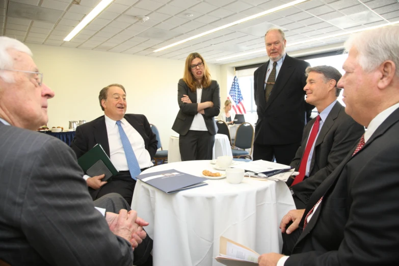 two men and three women having a conversation