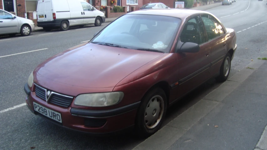 a red car parked on the side of the road