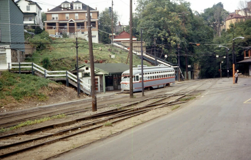 this is an old train station and a train on tracks