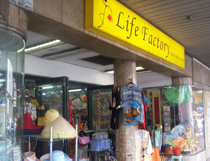 the storefront is decorated with clothes and gifts