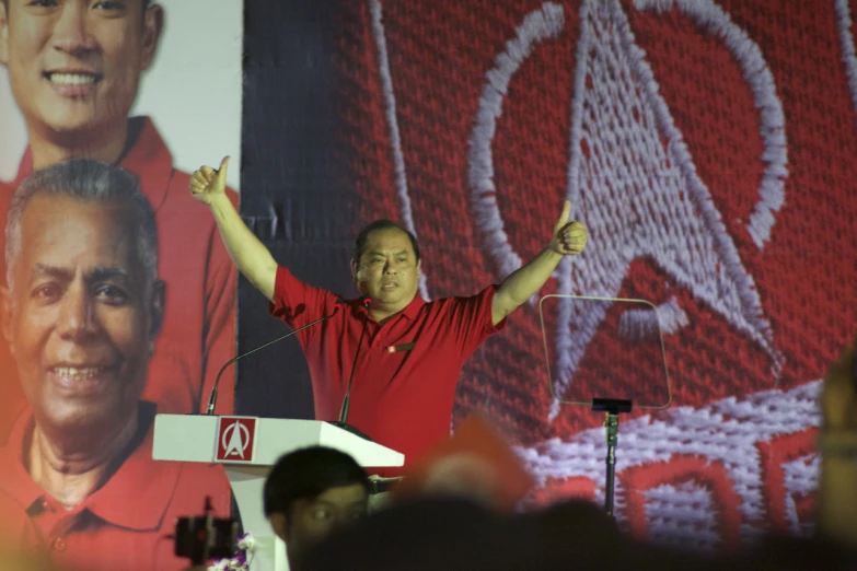 man giving speech to people at a convention