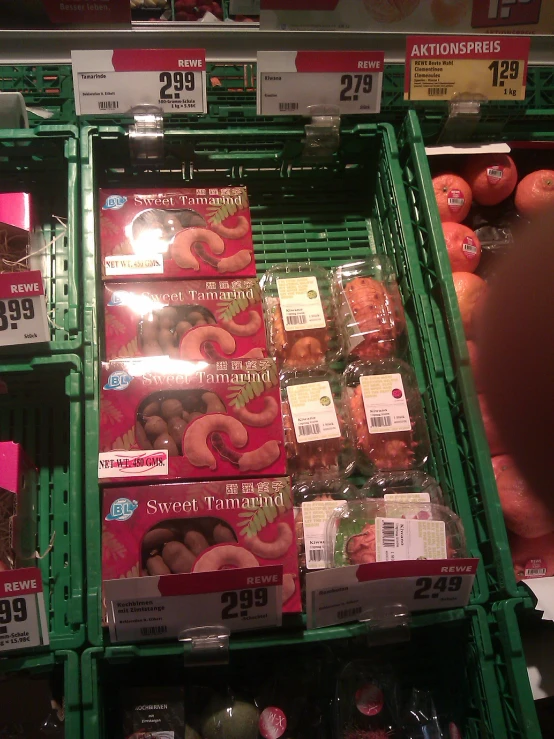 a display in a grocery store filled with lots of doughnuts