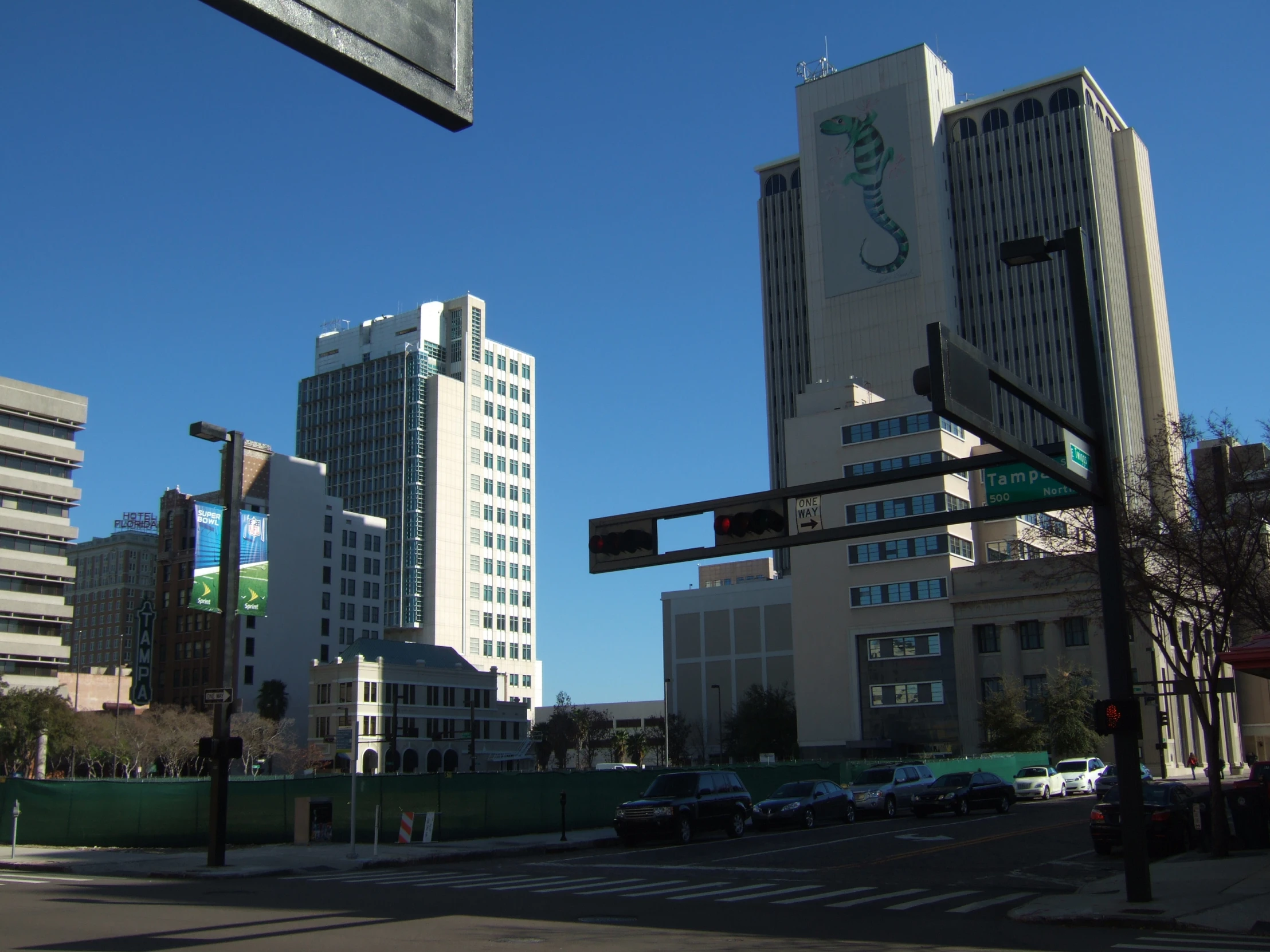 buildings and roads with a few traffic lights and signs