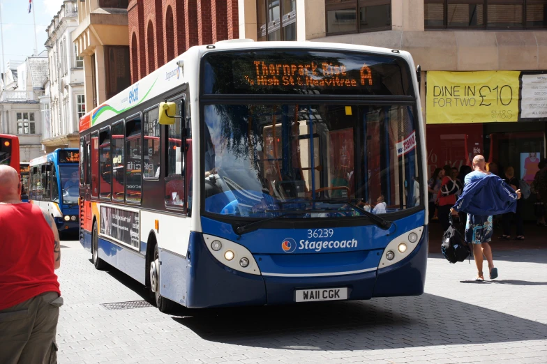 a city bus parked along the side of the road