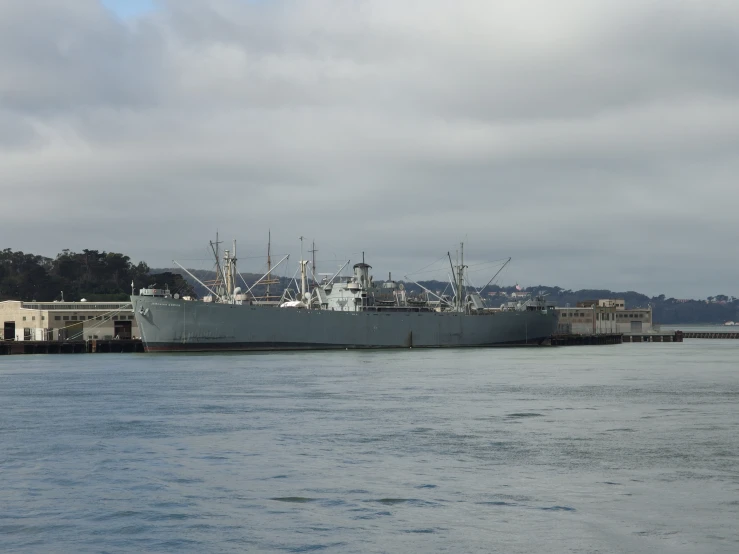 a large boat in the water with several buildings