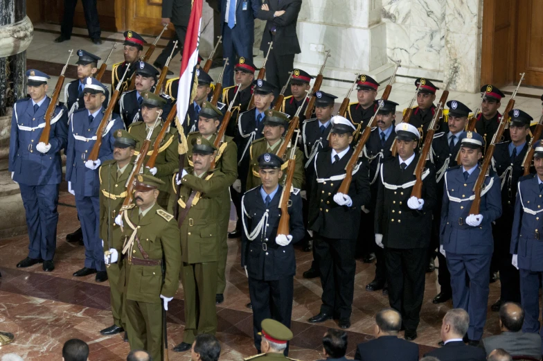 a large crowd of men and women in uniforms are gathered together