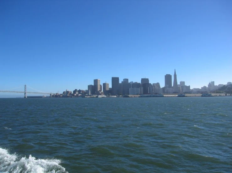 an over cast city and the water from a boat