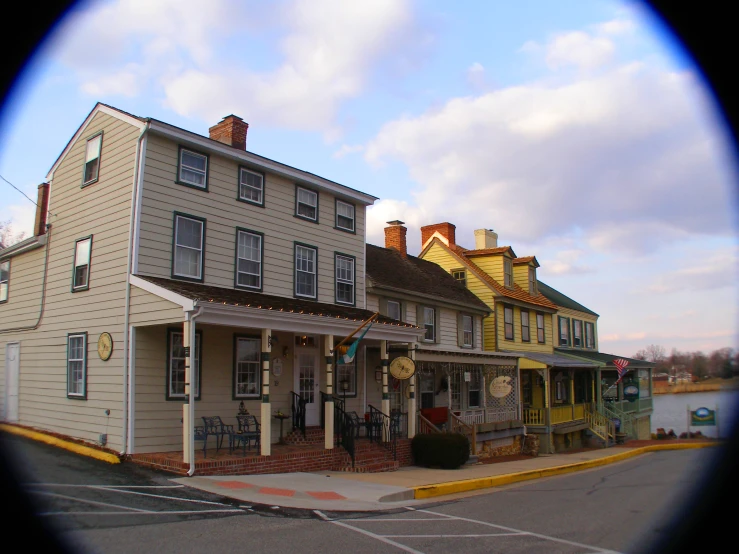 an old time city store is featured in this view through a scope lens