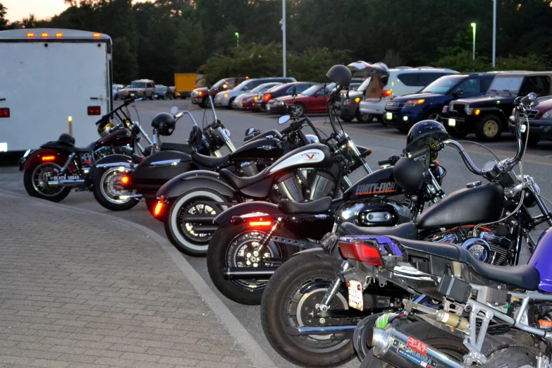 a large group of motorcycles lined up in the street