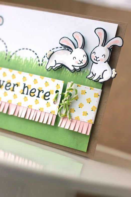 a card with rabbits on it and words below it