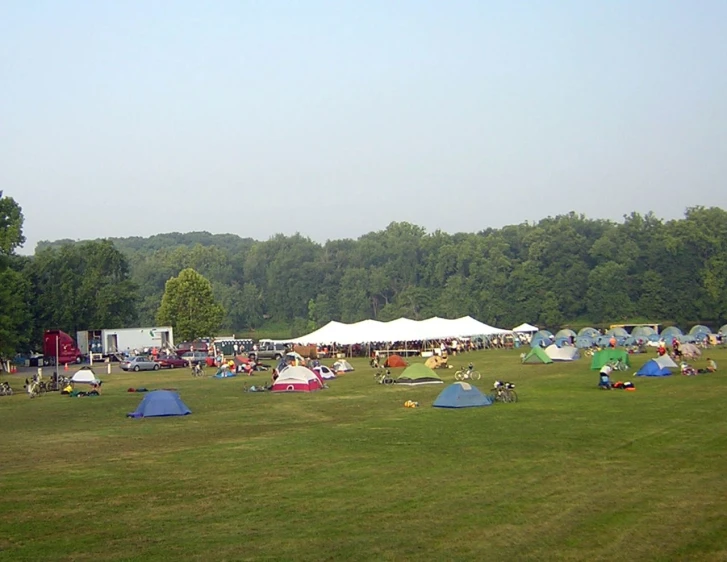 some tents are set up in the middle of a field