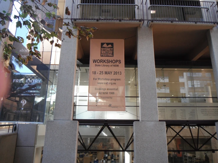 the entrance to a building with a large sign on it