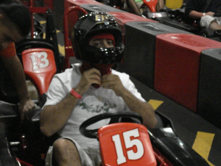 a person in a go kart during a sporting event