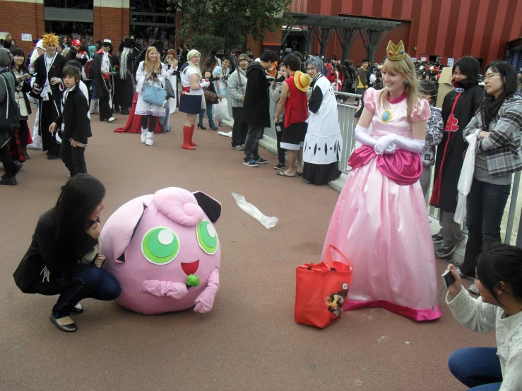 a large group of people standing around in costume