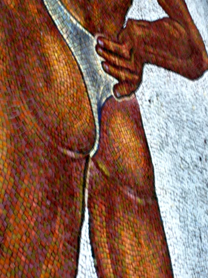 a mosaic of a female  torso and arm