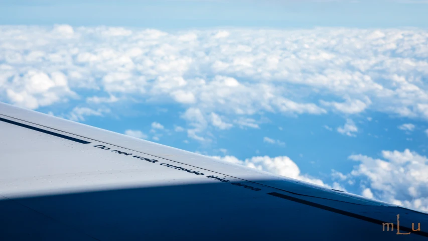 there is a view from the airplane window above clouds