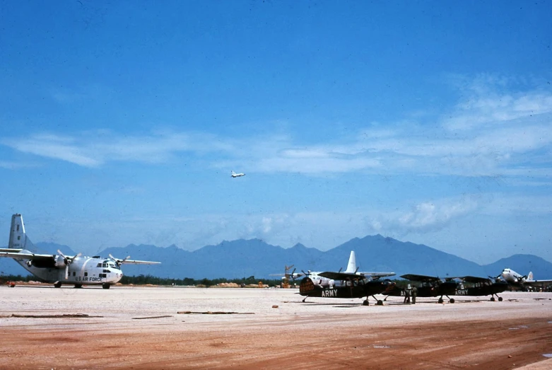 a line of airplanes that are on the ground