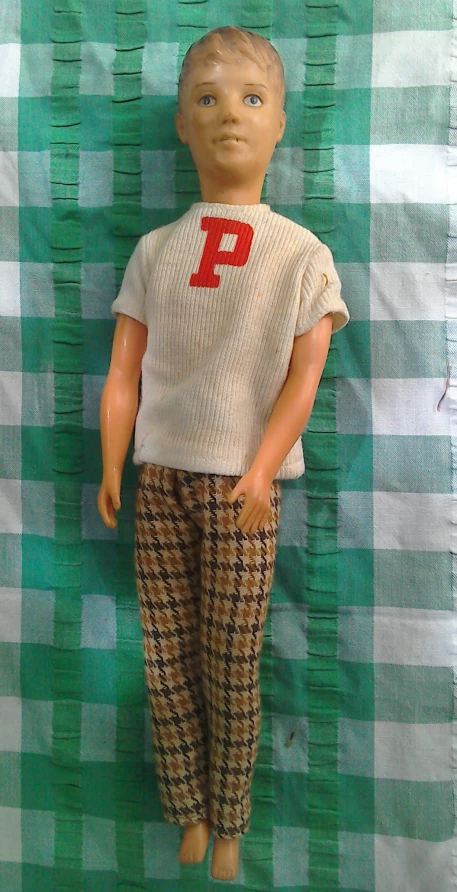 a doll wearing pajamas, a number 9 on it's back