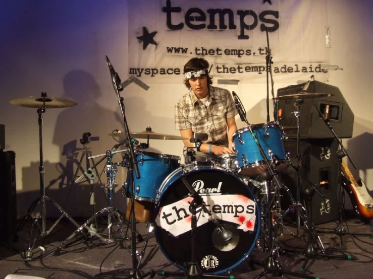 drummer and singer performing at the tempest festival