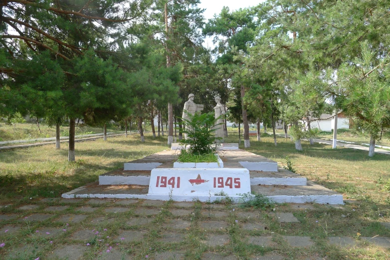 a cemetery with some trees and benches