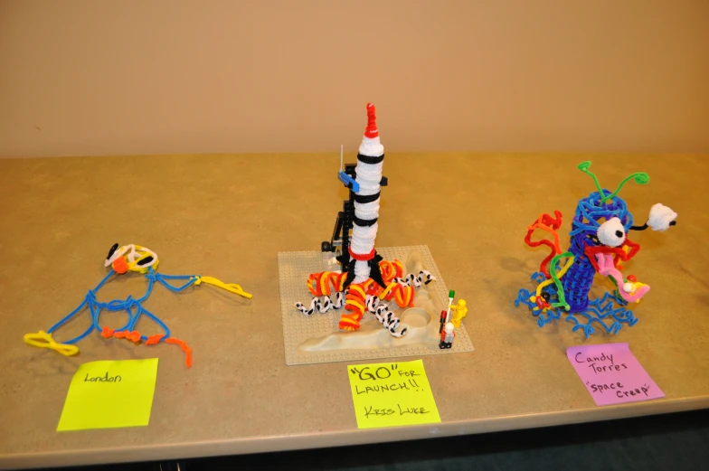 toys and paper notes displayed on a table