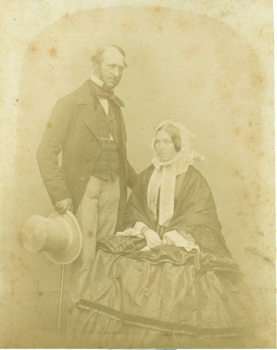 old time picture of man and woman posing for pograph