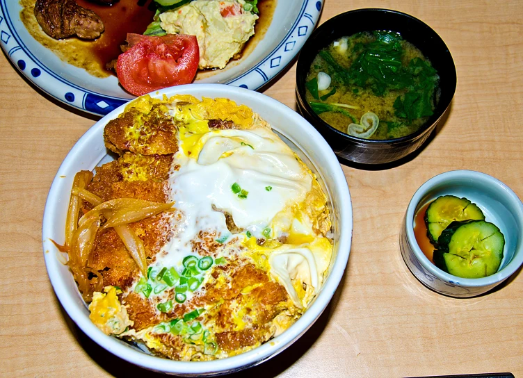 an assortment of dishes sit on the table