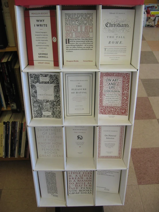 open books on an empty bookcase on a wall